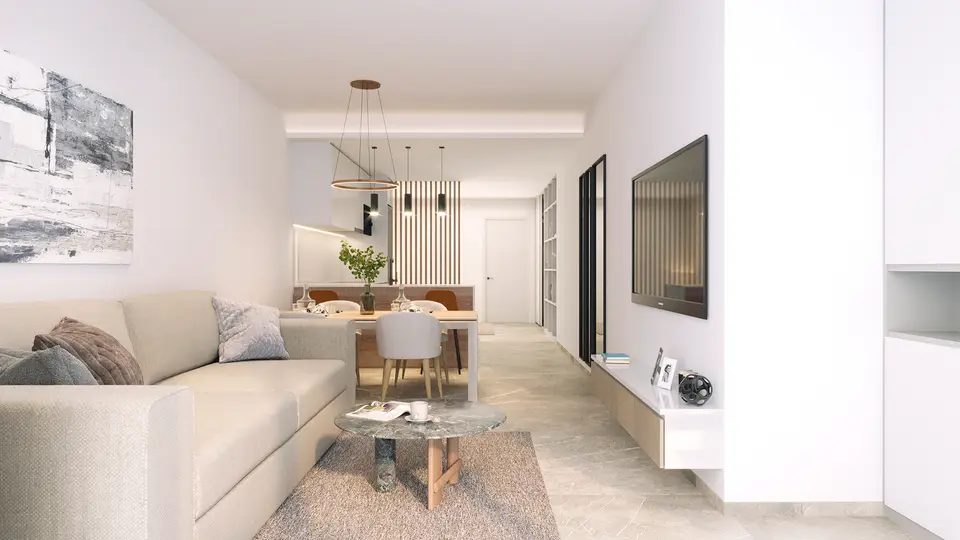 Open-plan living, dining and kitchen in a ground-floor apartment at Rodas Playa, with a light stone-effect porcelain floor
