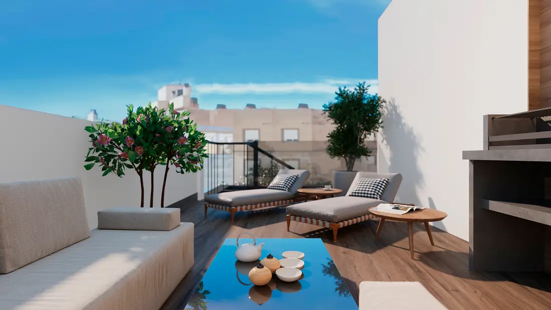 Private roof solarium of a Rodas Playa penthouse with a corner sofa, loungers and an outdoor kitchen